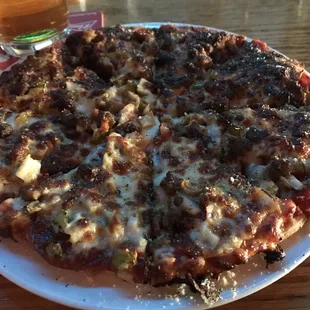 a pizza and a glass of beer