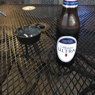 a bottle of beer on a table