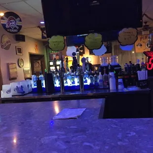 a bar with a neon sign