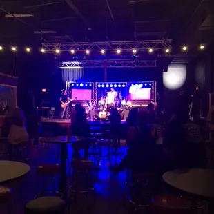 Cherry starts to perform the very first song for the night as the crowd starts to fill in the new and remodeled  listening area.