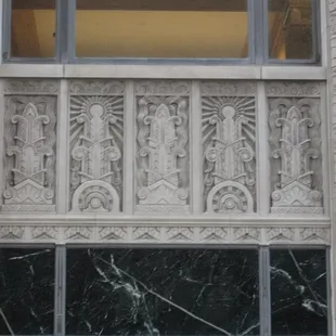 "Power" and "Light" reliefs in the limestone