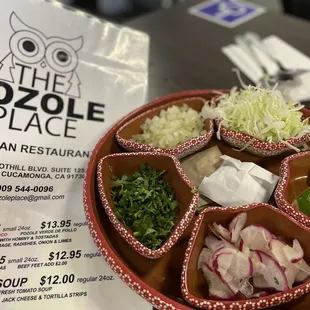 The fixings for the pozole. You can ask for tomatoes too if you like.
