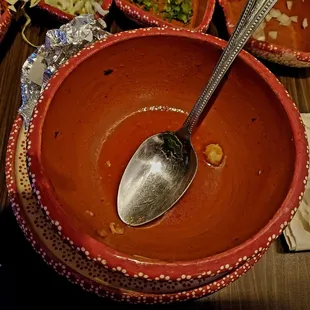 a bowl of soup with a spoon in it