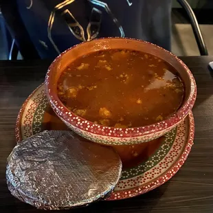 a bowl of soup on a plate