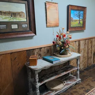 In the hallway, just off the main great room.  The story of *Rosie* . And a painting, capturing the essence of Rosie.