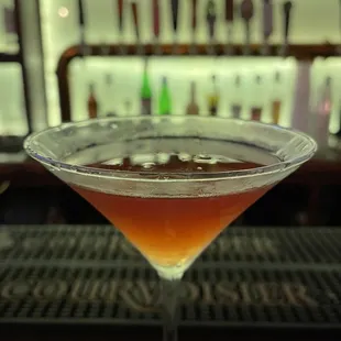 a cocktail in a martini glass