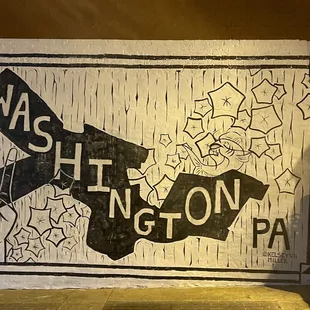 a street sign with graffiti