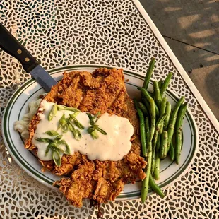 Chicken Fried Ribeye w/ a side of mac &apos;n cheese and green beans. 4/5. Would order again with a side of Buffalo sauce. July 2021