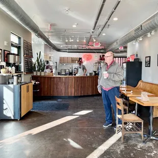 a man standing in a restaurant
