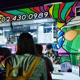 Line of customers at First Friday ordering mouth watering tacos.