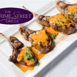 grilled lamb chops on a white plate