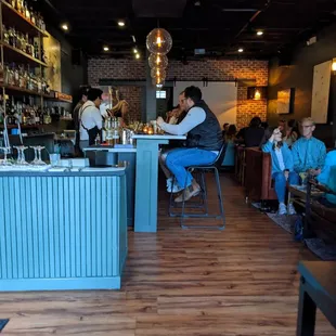 people sitting at a bar