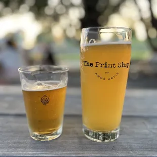 two glasses of beer on a table