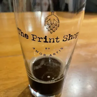 a glass of beer on a table