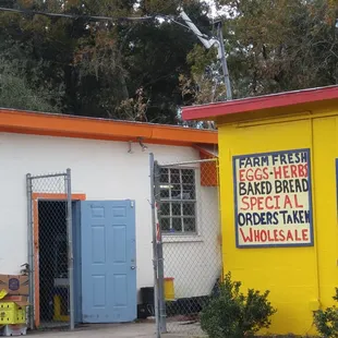 a yellow building with a blue door