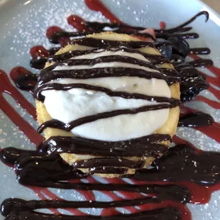 Cheesecake with chocolate drizzle added was delicious.