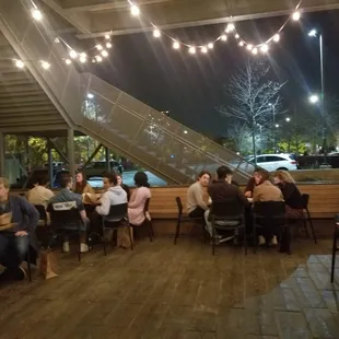a group of people eating at a restaurant