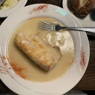 Potatoes crusted cod in lemon sherry sauce.