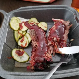Brisket and pulled pork with a side of pickles/onions