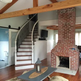 Dinning, fireplace and stairs to guess bedrooms