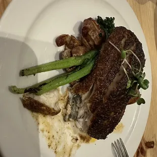 a plate of food on a wooden table