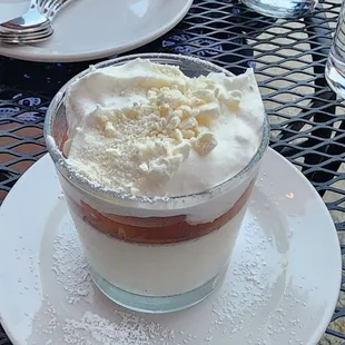 a cup of coffee with whipped cream on top