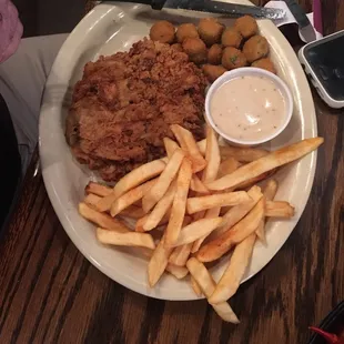 Chicken fried steak, fried okra, and fries