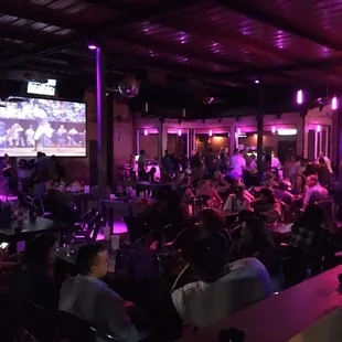 a large group of people sitting at tables