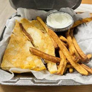 Grilled cheese with bacon and fries.