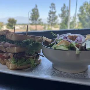a sandwich and a bowl of salad