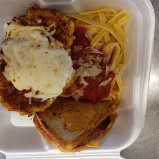 How about having some chicken fried steak and some fettuccine noodles with marinata sauce with a couple of slices of garlic bread