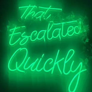 a neon sign that says that it is absolutely quickly