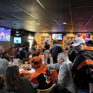 a large group of people sitting at tables