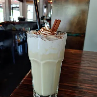 a milkshake with whipped cream and cinnamon