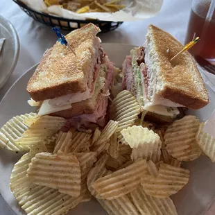 Greasy pub club with bagged potato chips.