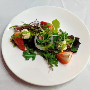 Mixed greens. Aged goat cheese, strawberries, coco-dusted chocolate almonds, strawberry vinaigrette.