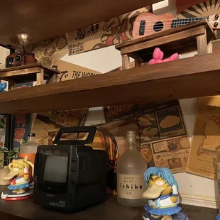 Anime figurines and decor on shelf