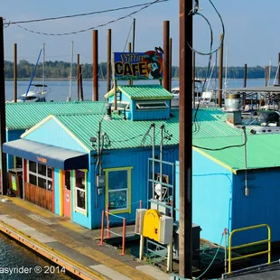 a blue building with a green roof