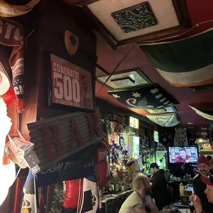 a group of people sitting at a bar