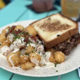 Brisket grilled cheese with trashy tots