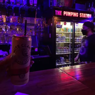 a person standing at a bar