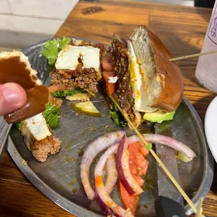 The goat burger has an egg one it!