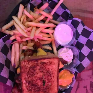 a basket of fries and a grilled cheese sandwich