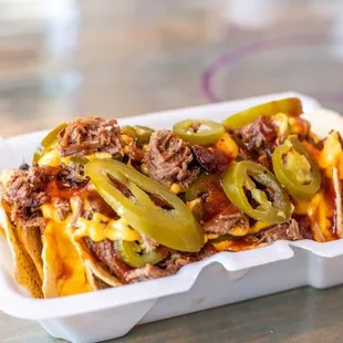 a close up of a sandwich in a styrofoam container