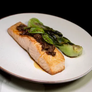 a piece of salmon on a white plate