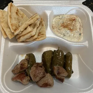 Lamb Kabob plate with grape leaves