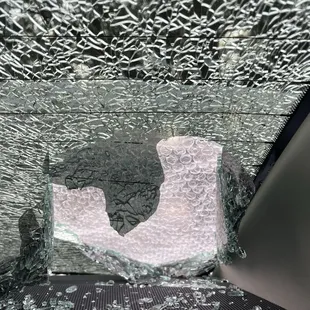 The broken window of my car
