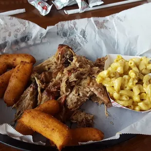 It is pulled pork and barbeque macncheese and hushpuppys