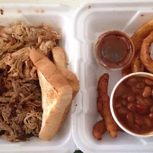 3-meat: brisket, pulled pork, pulled chicken, w/ baked beans, onion rings, and bread.