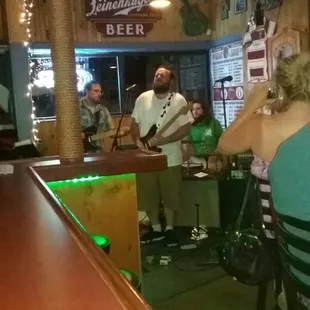 a group of people sitting at a bar